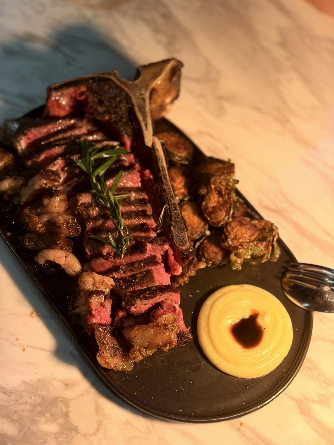 T-Bone with Charred Rosemary at Nomada